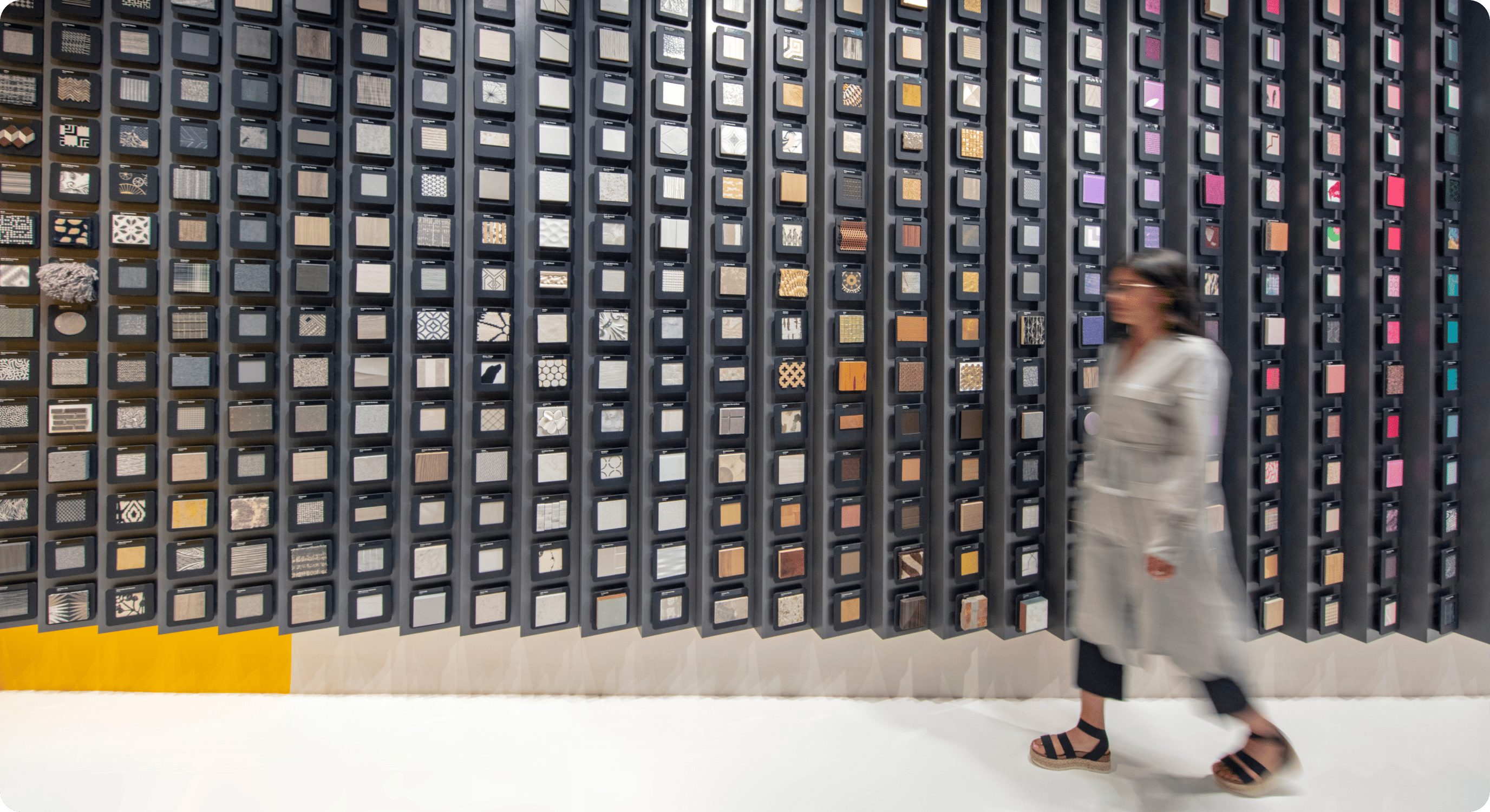 Woman passing the material wall